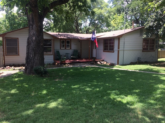 ranch-style house featuring a front lawn