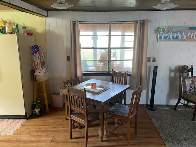 dining space featuring wooden ceiling and light wood-type flooring