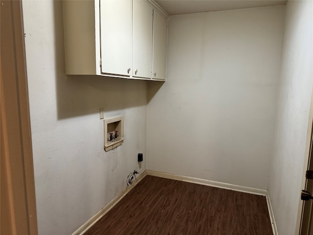 laundry room with cabinets, wood-type flooring, and washer hookup