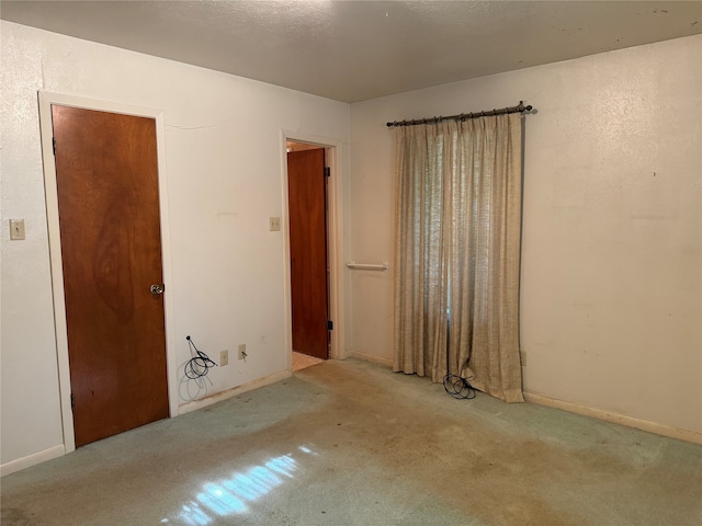 unfurnished bedroom featuring carpet