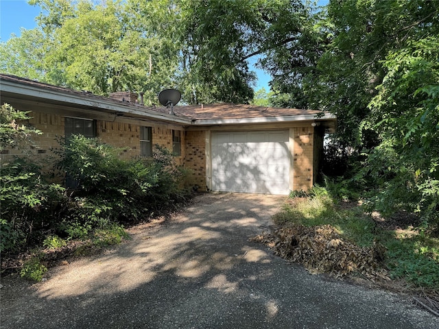 single story home featuring a garage