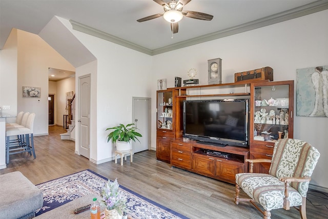 living room with ceiling fan, light wood-type flooring, and ornamental molding