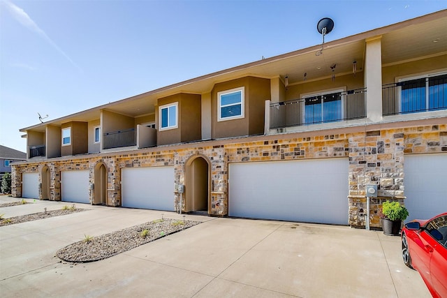 townhome / multi-family property with a balcony