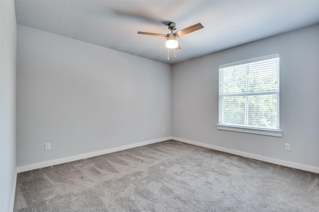 empty room with light carpet and ceiling fan