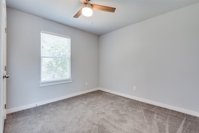 spare room with ceiling fan and carpet floors