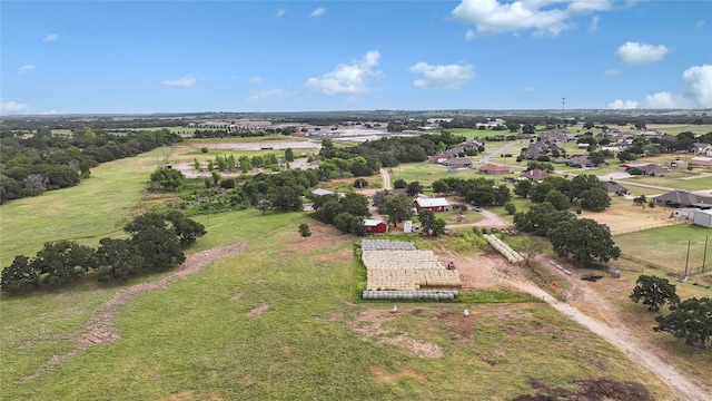 birds eye view of property with a rural view