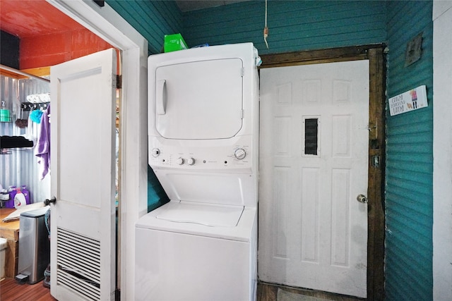 washroom with stacked washer and dryer