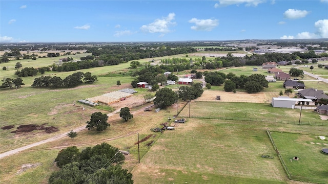 birds eye view of property with a rural view