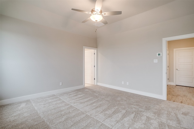 unfurnished room featuring light colored carpet and ceiling fan