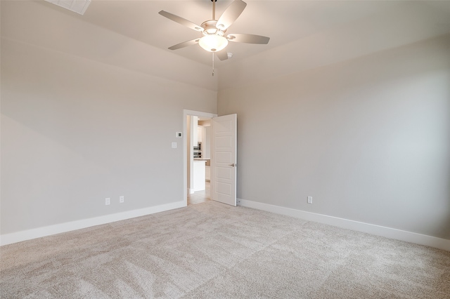 empty room with light carpet and ceiling fan