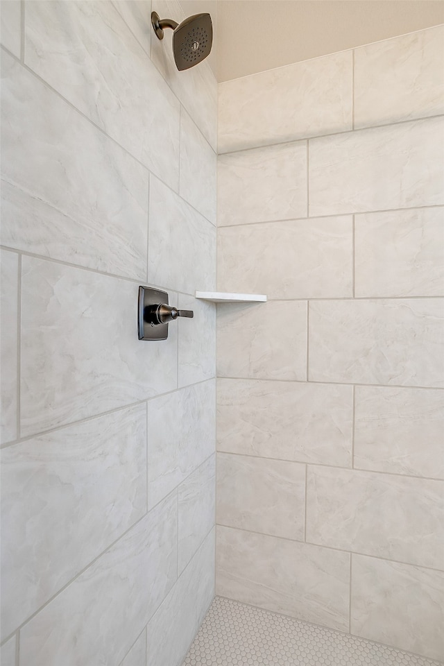 bathroom with a tile shower