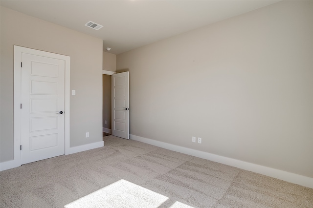 unfurnished bedroom featuring light colored carpet