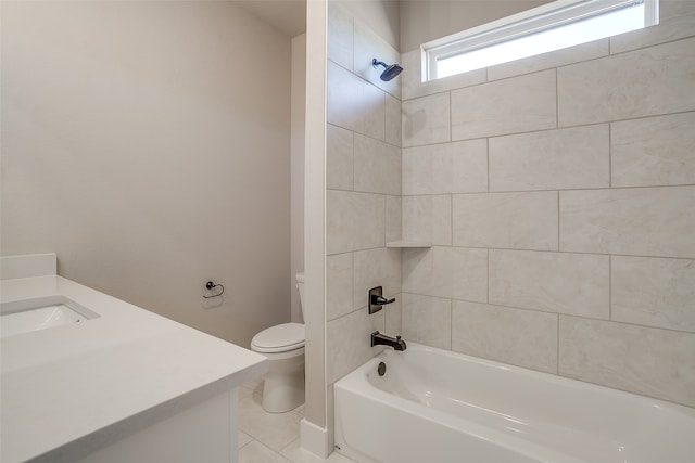 full bathroom with toilet, tiled shower / bath combo, vanity, and tile patterned flooring