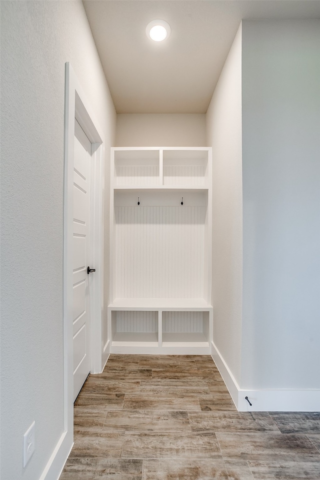 mudroom with hardwood / wood-style flooring