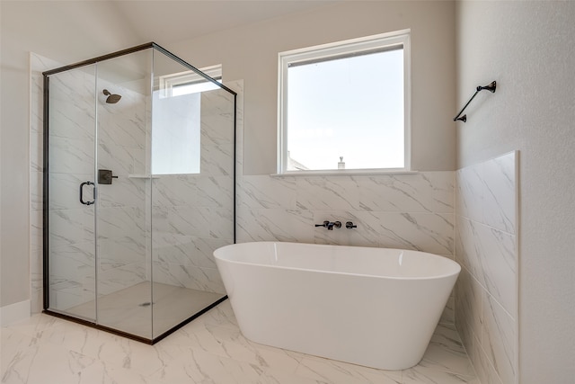 bathroom with independent shower and bath and tile walls