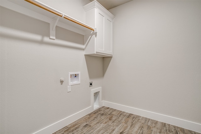 washroom featuring washer hookup, light wood-type flooring, electric dryer hookup, and cabinets