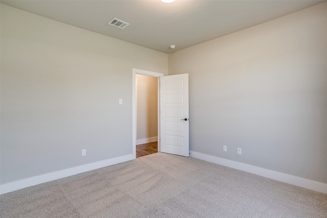 unfurnished room featuring carpet flooring