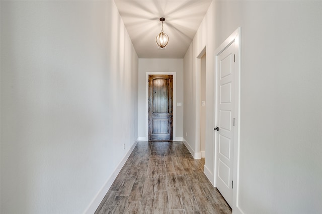 corridor with light wood-type flooring