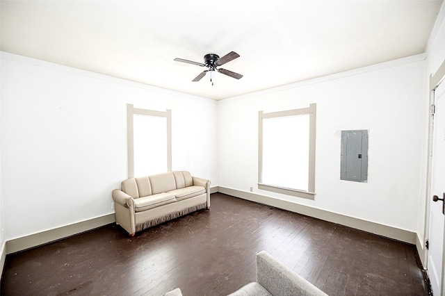 unfurnished room with crown molding, dark wood-type flooring, ceiling fan, and electric panel