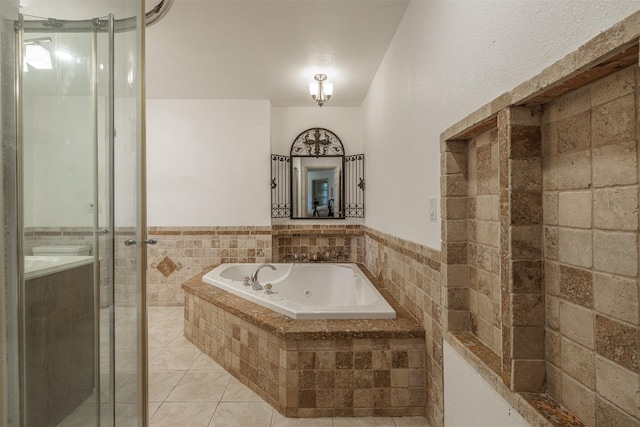 1457 Riverside Dr, West Tawakoni, TX 75474 - bathroom with tile patterned floors, a whirlpool tub, and a stall shower