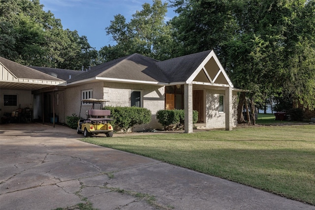 1457 Riverside Dr, West Tawakoni, TX 75474 - view of front of property featuring brick siding, a front lawn, concrete driveway, and roof with shingles