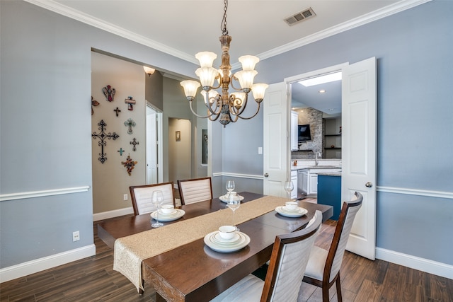 dining area with a chandelier, dark hardwood / wood-style flooring, and ornamental molding