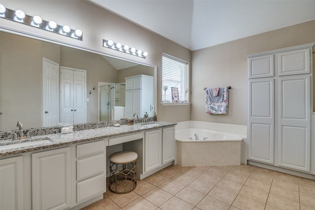 bathroom with separate shower and tub, tile patterned floors, and double sink vanity