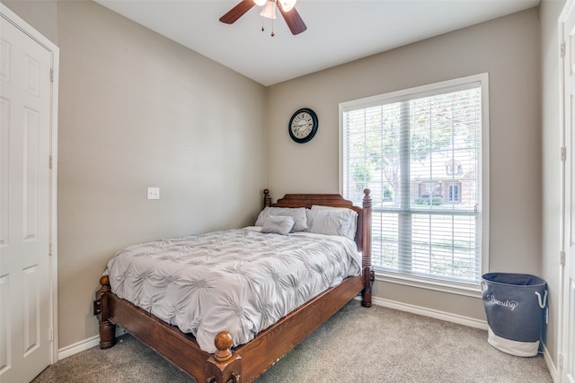 bedroom with multiple windows, carpet floors, and ceiling fan