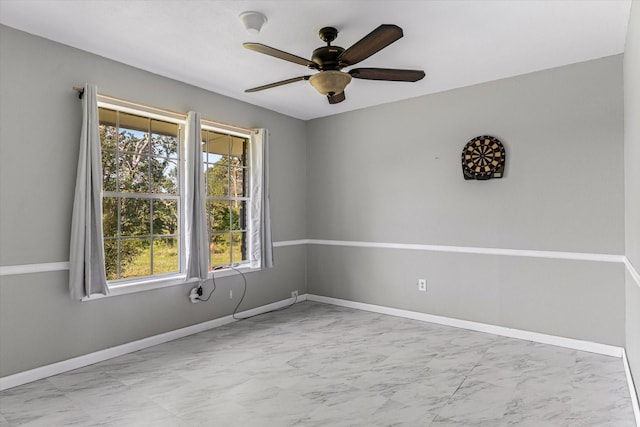 unfurnished room featuring plenty of natural light and ceiling fan