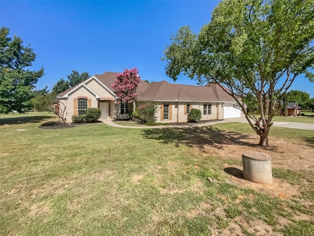 ranch-style house featuring a garage and a front yard