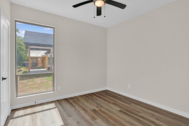 spare room featuring ceiling fan and hardwood / wood-style floors