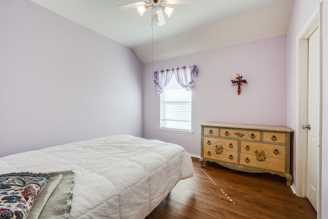 bedroom with lofted ceiling, hardwood / wood-style floors, and ceiling fan