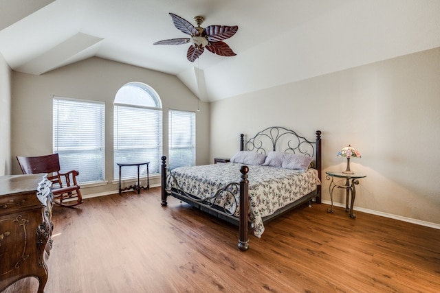 bedroom with wood-type flooring, ceiling fan, and lofted ceiling