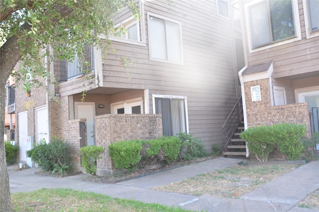 view of side of property with a balcony