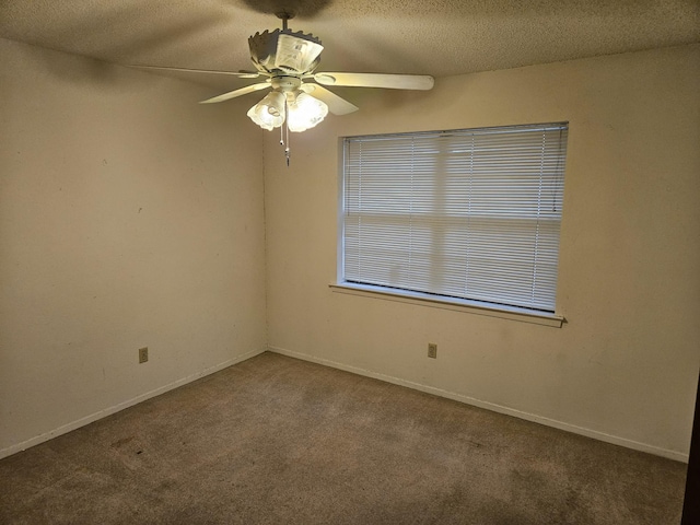 unfurnished room with ceiling fan, carpet floors, and a textured ceiling