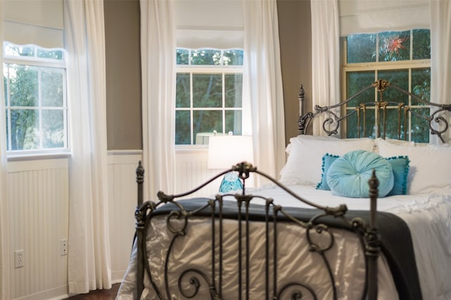 sitting room featuring french doors, hardwood / wood-style floors, and a high ceiling