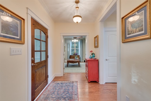 living room with crown molding, hardwood / wood-style floors, and french doors