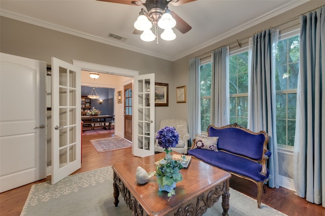 dining area featuring wood-type flooring and crown molding