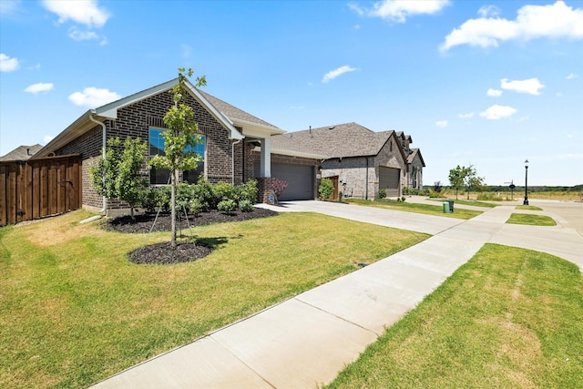 view of front of property featuring a front lawn and a garage