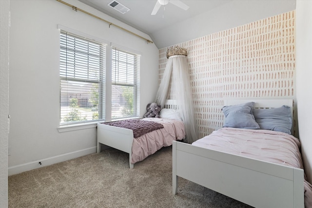 bedroom featuring ceiling fan, vaulted ceiling, and carpet floors