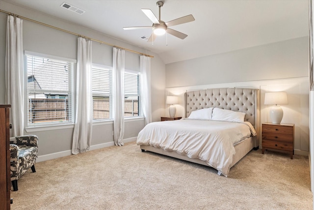 carpeted bedroom with ceiling fan and lofted ceiling