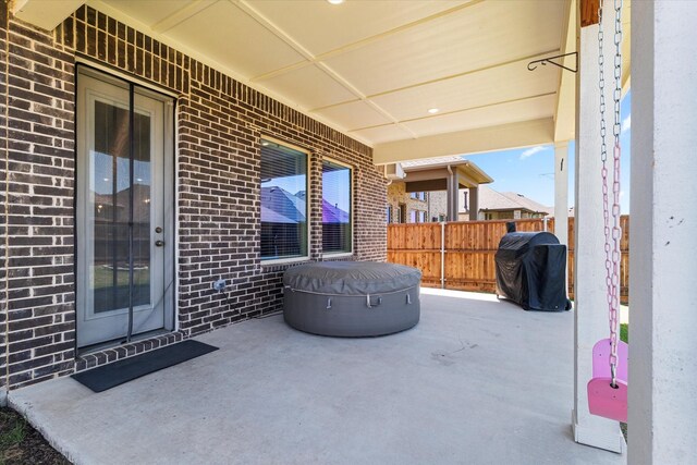 garage featuring water heater, a garage door opener, and electric panel