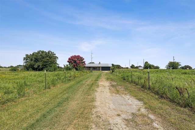 view of street featuring a rural view and driveway