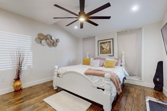 bedroom featuring ceiling fan, dark hardwood / wood-style floors, and vaulted ceiling