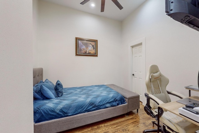 bedroom featuring ceiling fan and hardwood / wood-style flooring