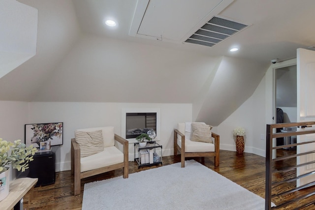 sitting room with dark hardwood / wood-style floors and lofted ceiling