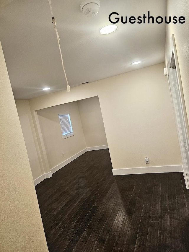 basement with dark wood-type flooring