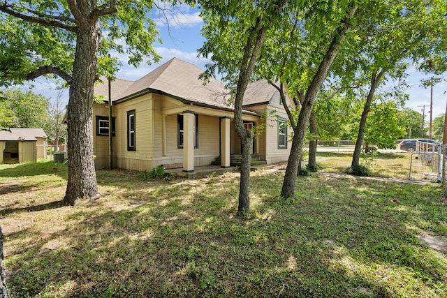 view of side of property with a yard