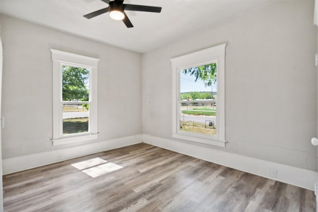 unfurnished room featuring hardwood / wood-style flooring and ceiling fan