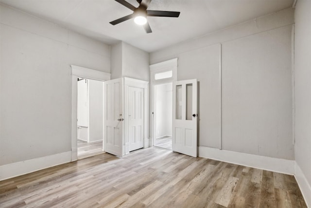 unfurnished bedroom featuring ceiling fan and light hardwood / wood-style floors